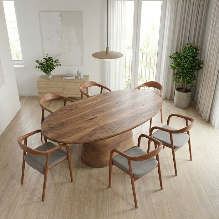 Dining area with wooden table and midcentury chairs in a room